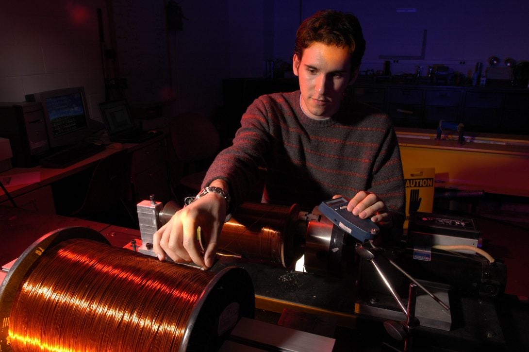 student working with lab equipment