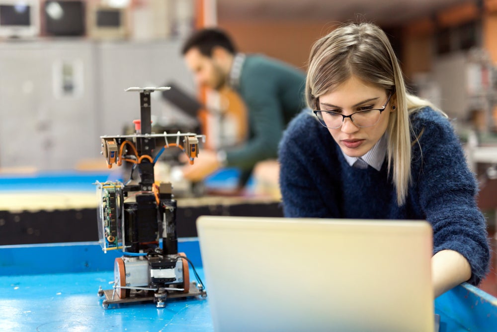 student working with robotics equipment