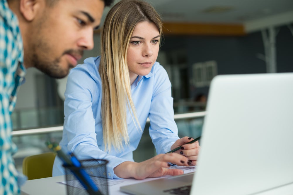 students working at a laptop