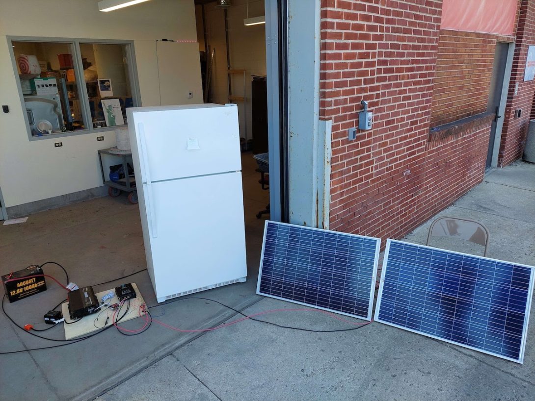 Team AC2DC's refrigerator with solar panels and controls