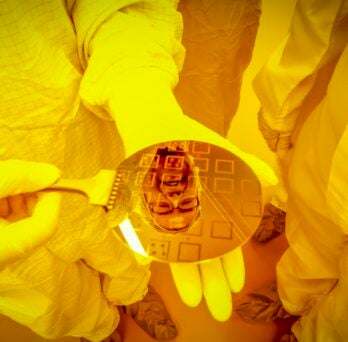 researcher reflected in wafer chip 